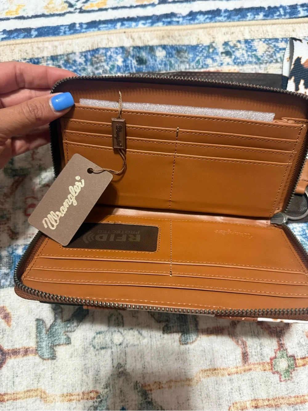 Wrangler Cow-Print Zip Wristlet Wallet in White, Black & Brown
